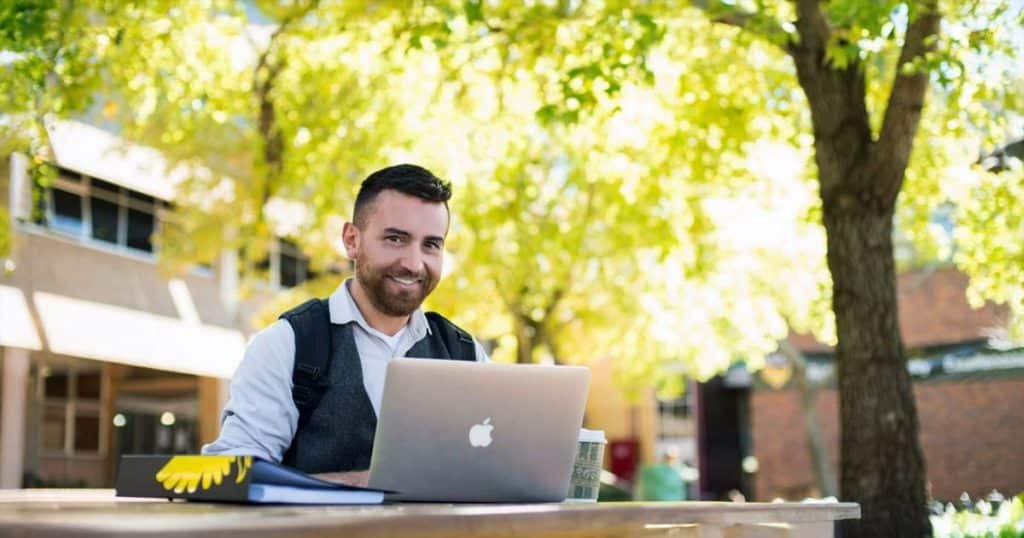 Student in quiet spot of Toowoomba campus