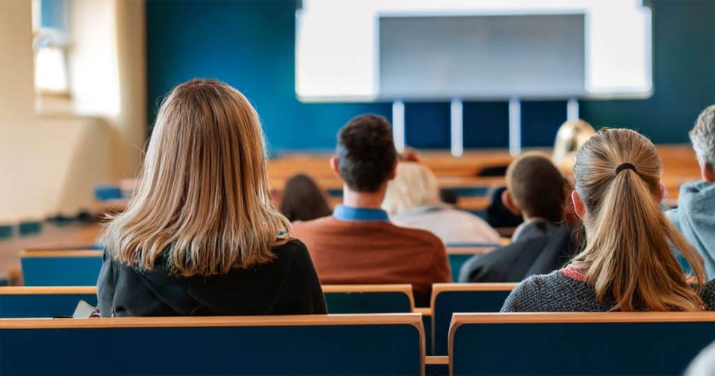 Uni students watching a presentation