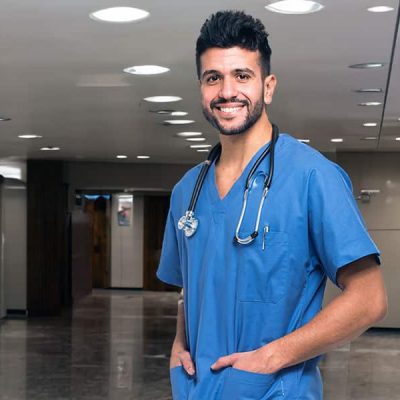 Young male nurse in hospital lobby