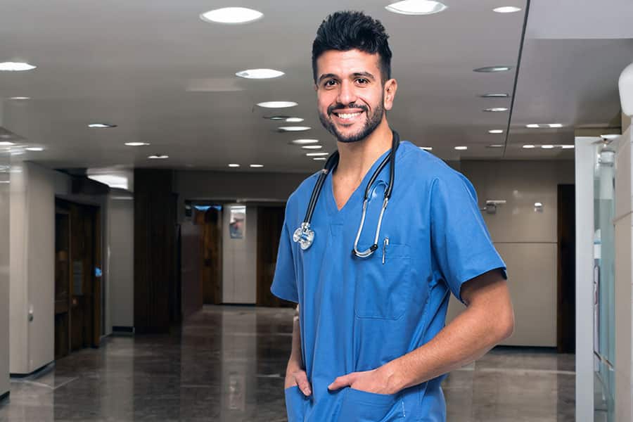Young male nurse in hospital lobby